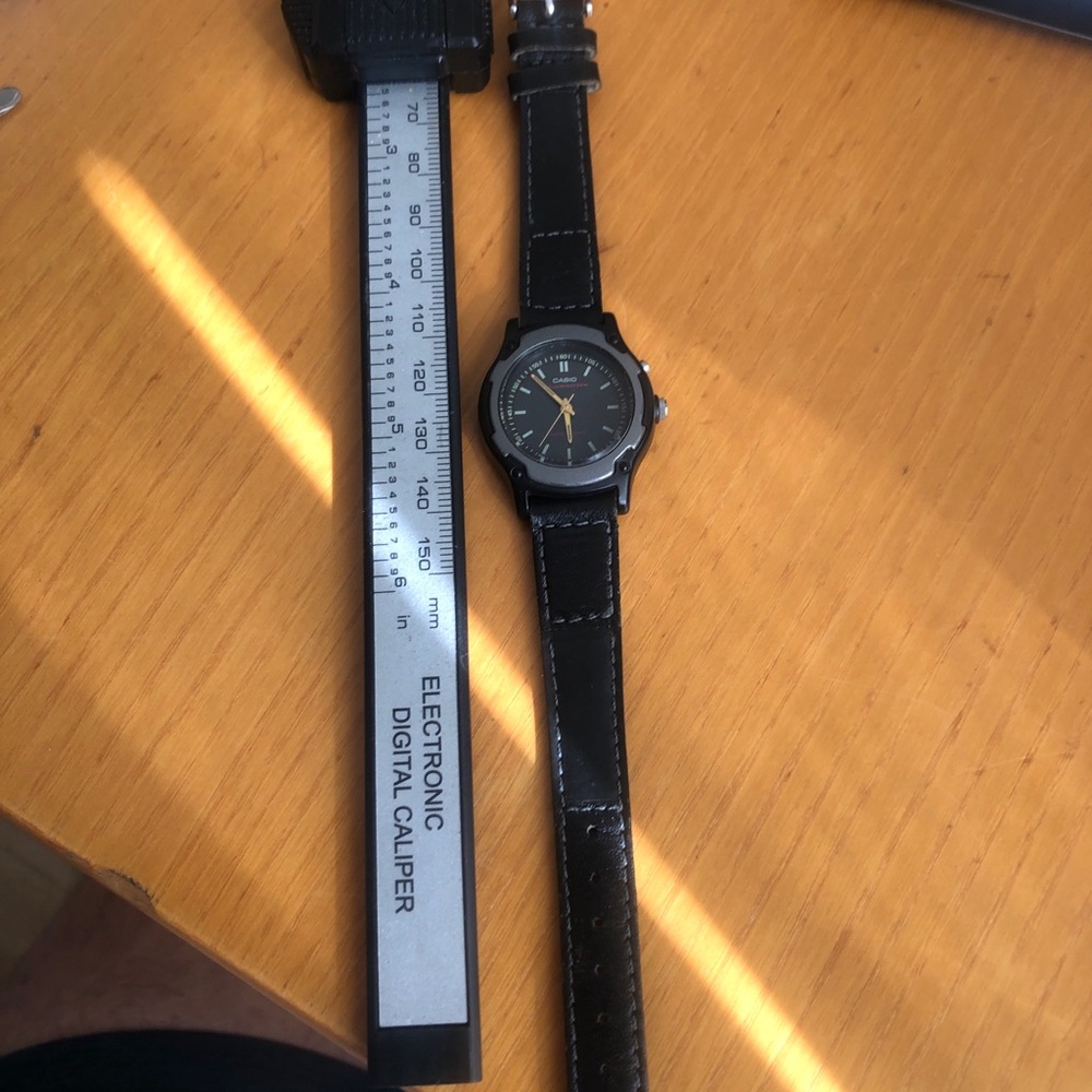 Casio Black Leather Strap Watch with Gold Accents